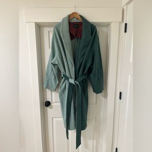 Green two-tone, trench-style coat from Eloquii